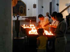 Lighting Prayer Candles a.jpg (27845 bytes)